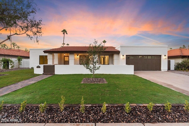 8014 E Del Tesoro Dr, Scottsdale, AZ 85258 - view of front of home with a garage, concrete driveway, a tile roof, a front lawn, and stucco siding