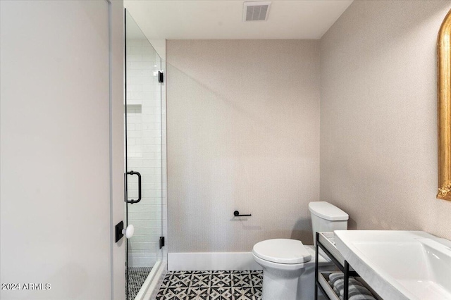 8014 E Del Tesoro Dr, Scottsdale, AZ 85258 - bathroom with baseboards, a shower stall, toilet, and a sink