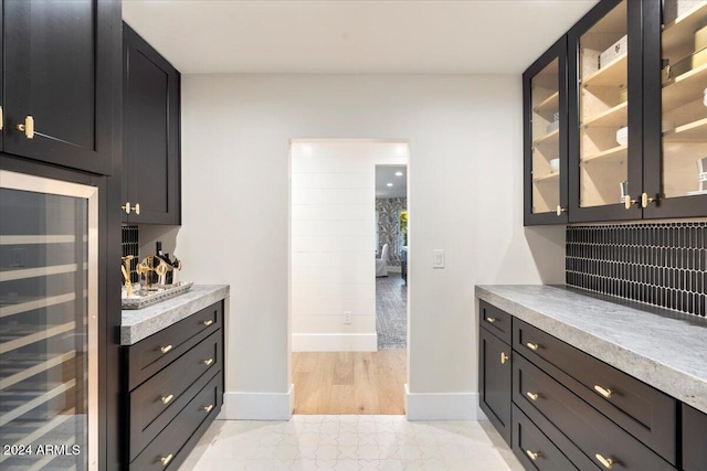 8014 E Del Tesoro Dr, Scottsdale, AZ 85258 - ensuite bathroom with wood finished floors, french doors, recessed lighting, and a glass covered fireplace