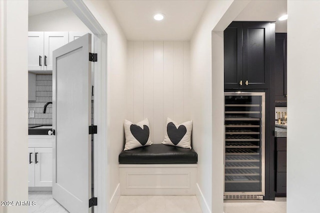 interior space featuring wine cooler and sink