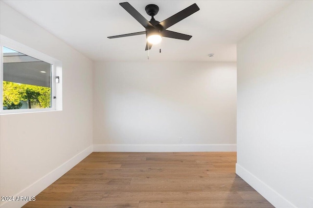 unfurnished room with light hardwood / wood-style floors and ceiling fan