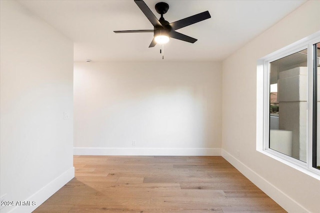 spare room featuring light hardwood / wood-style floors and ceiling fan