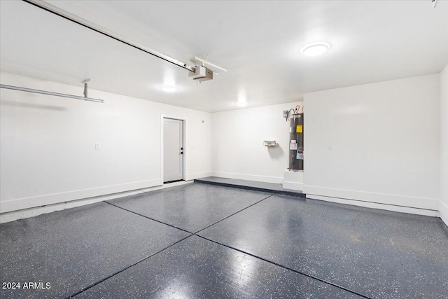 garage featuring a garage door opener and electric water heater