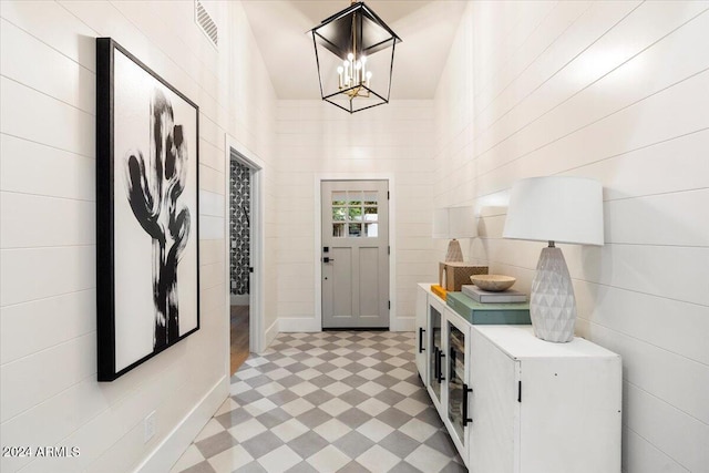 entryway with an inviting chandelier