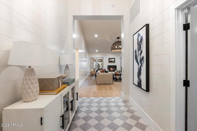 hallway with hardwood / wood-style floors