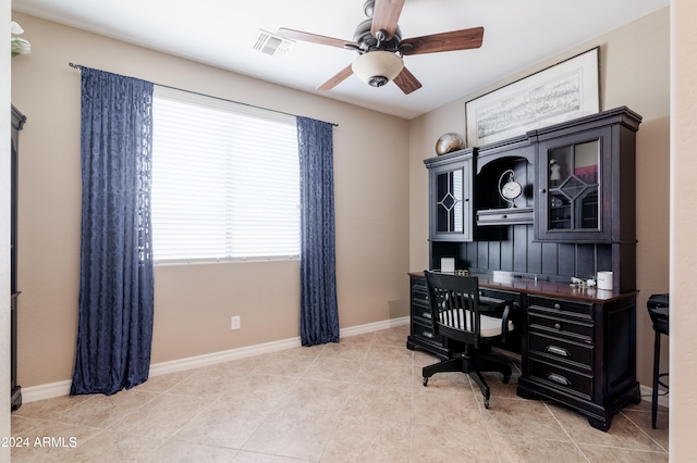 tiled office space with ceiling fan