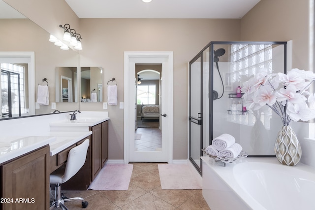 bathroom featuring vanity, plus walk in shower, and tile patterned flooring