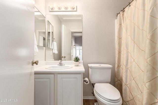 full bathroom featuring vanity, toilet, and curtained shower