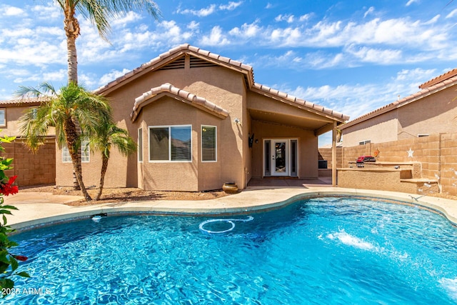 view of pool with a fenced in pool, fence private yard, and a patio area