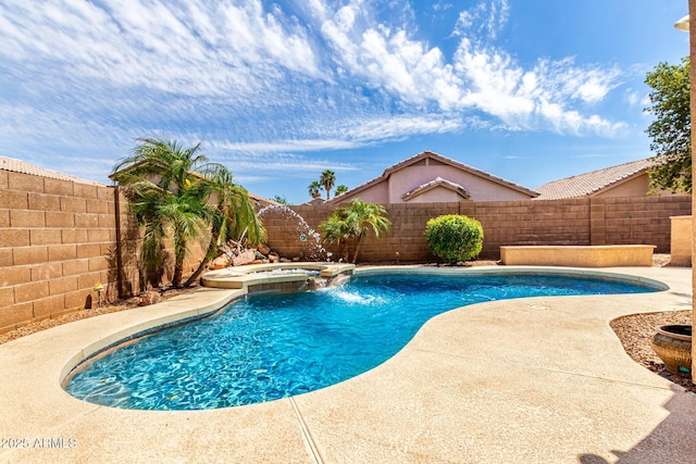 view of swimming pool with a patio, a pool with connected hot tub, and a fenced backyard