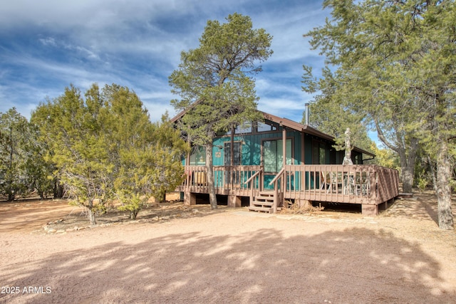 2273 Trail Cir, Overgaard, AZ 85933 - view of front facade featuring a wooden deck and a sunroom