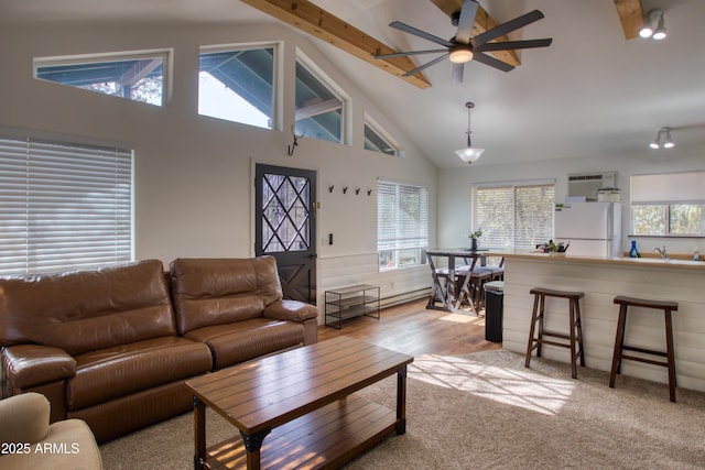 2273 Trail Cir, Overgaard, AZ 85933 - living room featuring a ceiling fan, high vaulted ceiling, and beamed ceiling