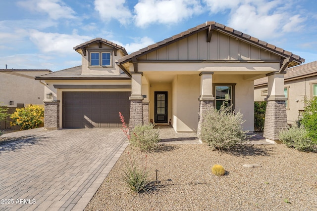 8140 E June St, Mesa, AZ 85207 - craftsman inspired home featuring stucco siding, decorative driveway, stone siding, and a tiled roof