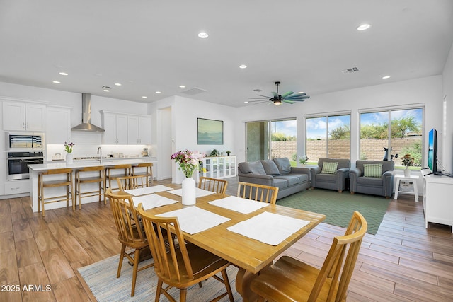 8140 E June St, Mesa, AZ 85207 - dining area featuring light wood-type flooring, a ceiling fan, visible vents, and recessed lighting