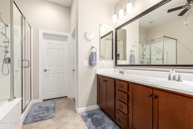 bathroom featuring walk in shower, ceiling fan, vanity, and tile patterned flooring