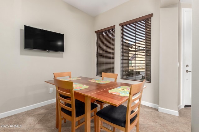 dining space with light tile patterned floors