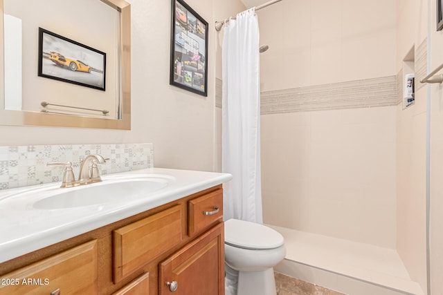 bathroom featuring vanity, decorative backsplash, toilet, and a shower with shower curtain