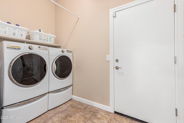 laundry room with washing machine and dryer