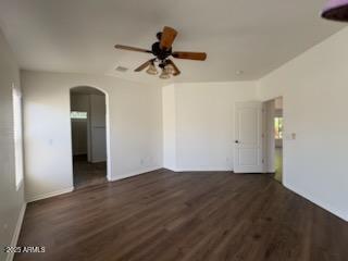 500 S Santa Fe Trl, Cornville, AZ 86325 - unfurnished room with arched walkways, wood finished floors, and a ceiling fan