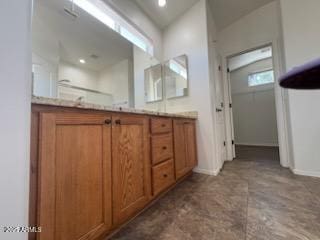 500 S Santa Fe Trl, Cornville, AZ 86325 - bathroom featuring double vanity, baseboards, and a shower