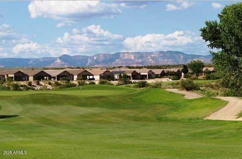 500 S Santa Fe Trl, Cornville, AZ 86325 - view of home's community featuring a mountain view, view of golf course, an area to practice putting, and a yard