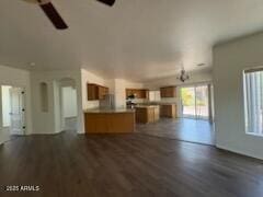 500 S Santa Fe Trl, Cornville, AZ 86325 - unfurnished living room featuring healthy amount of natural light, dark wood-type flooring, and ceiling fan
