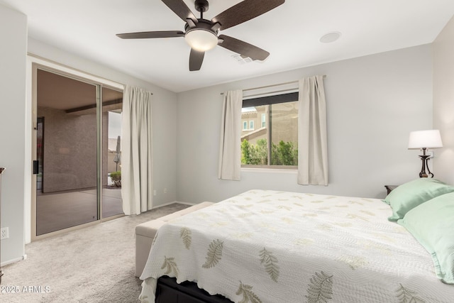 carpeted bedroom featuring access to exterior, a ceiling fan, and visible vents