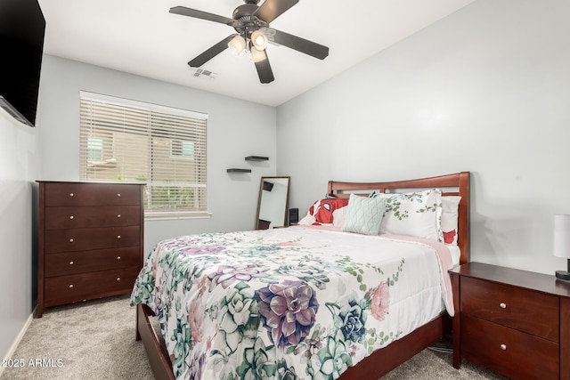 bedroom with visible vents, baseboards, carpet, and a ceiling fan