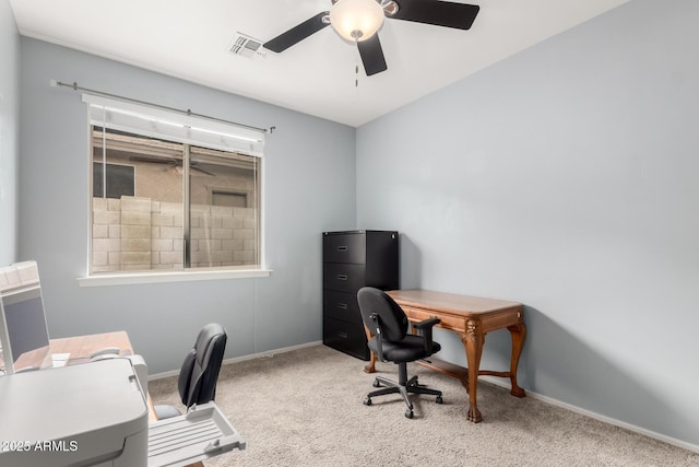 carpeted office space featuring visible vents, baseboards, and a ceiling fan