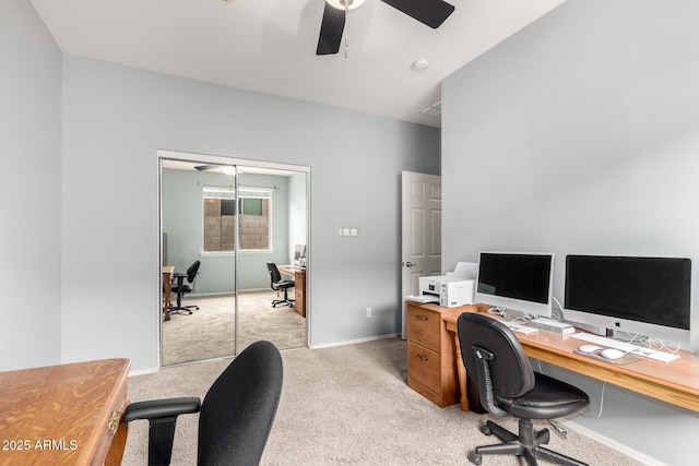 home office with light carpet, baseboards, and a ceiling fan