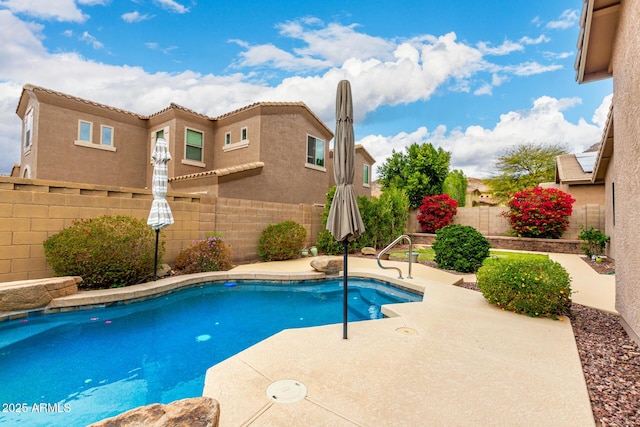 view of swimming pool featuring a fenced in pool, a patio, and a fenced backyard