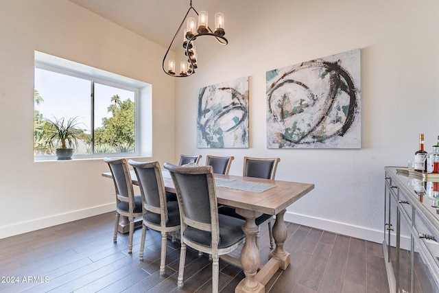 dining area featuring baseboards, dark wood-style flooring, and an inviting chandelier