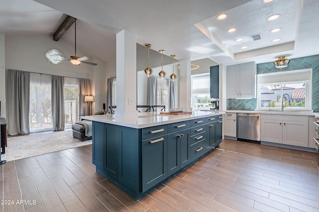 kitchen featuring plenty of natural light, visible vents, light countertops, and stainless steel dishwasher