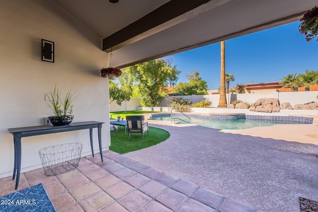 view of patio with a fenced in pool and a fenced backyard