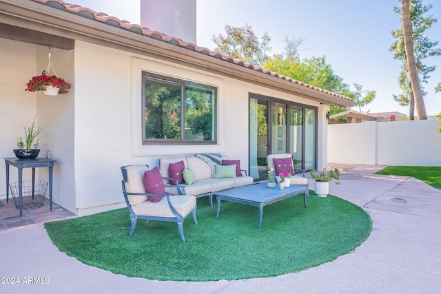 view of patio / terrace featuring fence and an outdoor living space