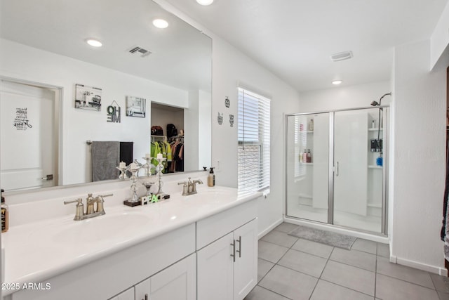 bathroom with vanity, tile patterned flooring, and a shower with shower door