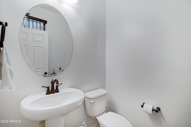 bathroom with sink and toilet