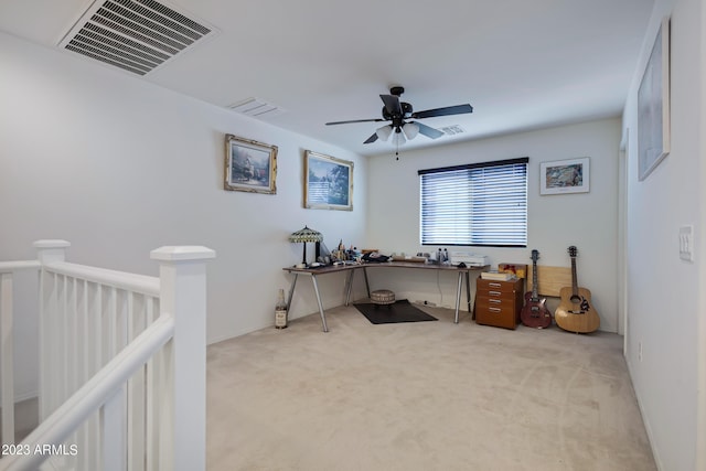 office space with light carpet and ceiling fan