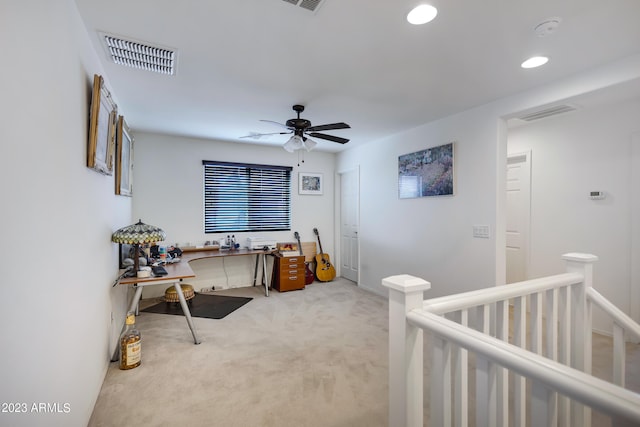 carpeted bedroom with a nursery area and ceiling fan