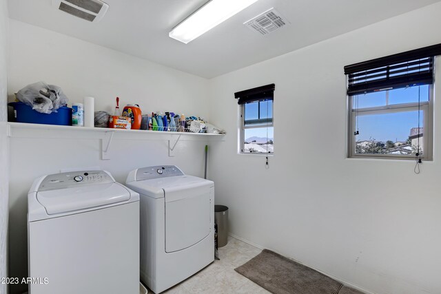 laundry area with washer and clothes dryer