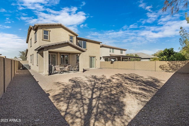 back of property featuring a patio area