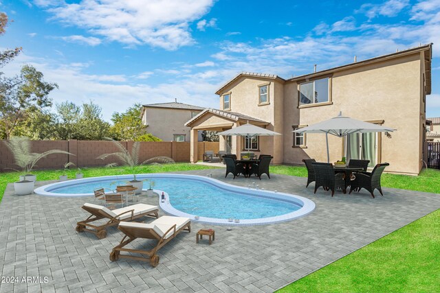 view of pool featuring a patio