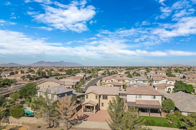 birds eye view of property with a mountain view