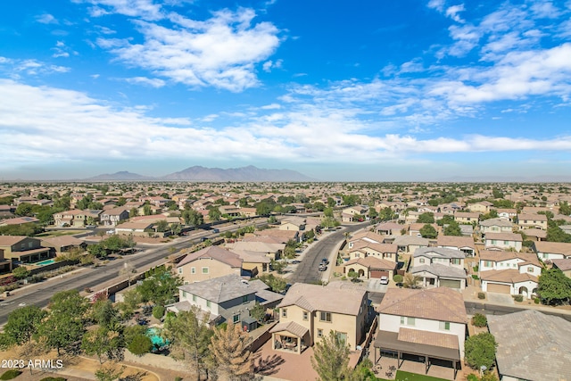 birds eye view of property featuring a mountain view