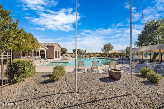 view of swimming pool featuring a patio area