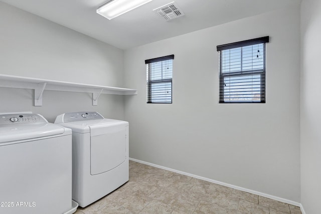 laundry area with separate washer and dryer