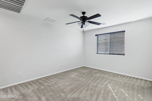 empty room with light colored carpet and ceiling fan