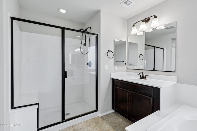 bathroom with vanity and separate shower and tub