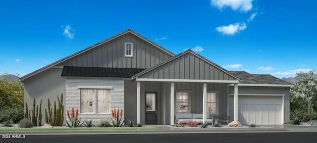 view of front of home featuring a garage, board and batten siding, and brick siding