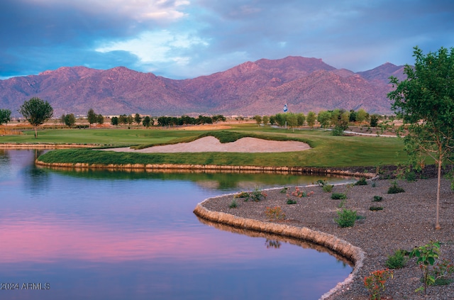 surrounding community featuring a yard and a water and mountain view